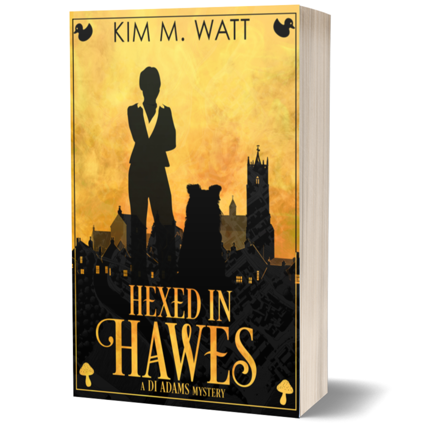 Book cover of 'Hexed in Hawes' by Kim M. Watt with a silhouette of a person and dog against a sunset sky.